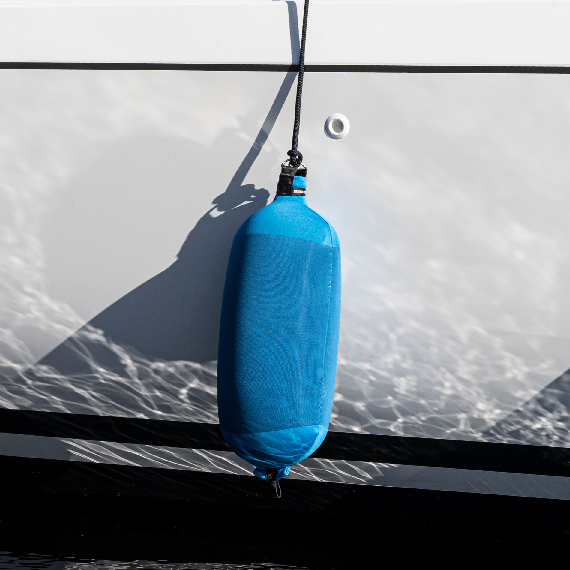 Royal Blue Fendertex cylindrical fender on sailboat