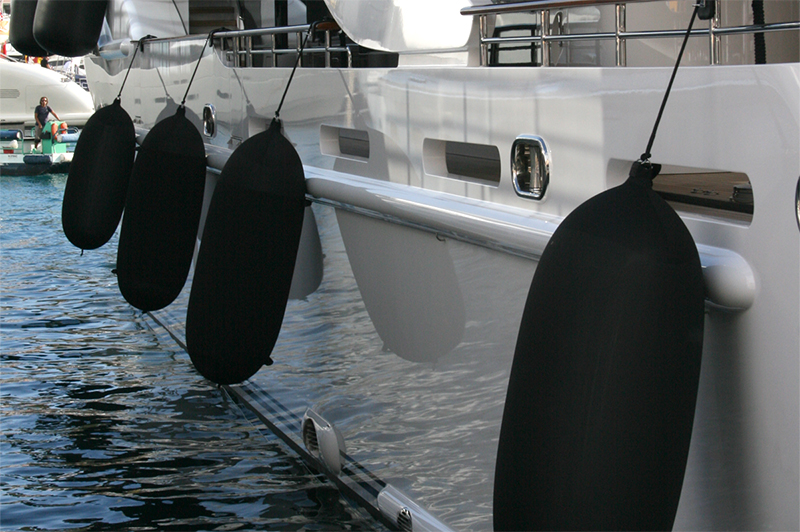 Black Fendertex fenders on catamaran