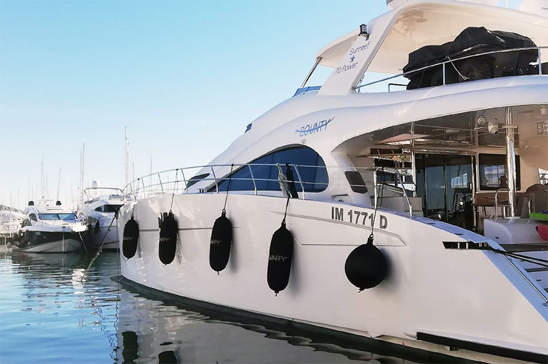 Custom black Fendertex fenders on powerboat