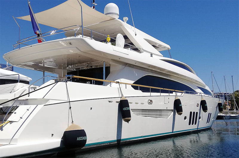 Custom beige and black Fendertex fenders on powerboat