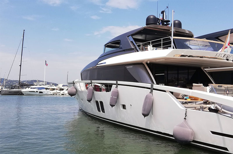 Custom gray Fendertex fenders on powerboat