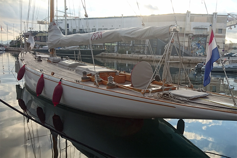 Red Fendertex fenders on classic sailboat