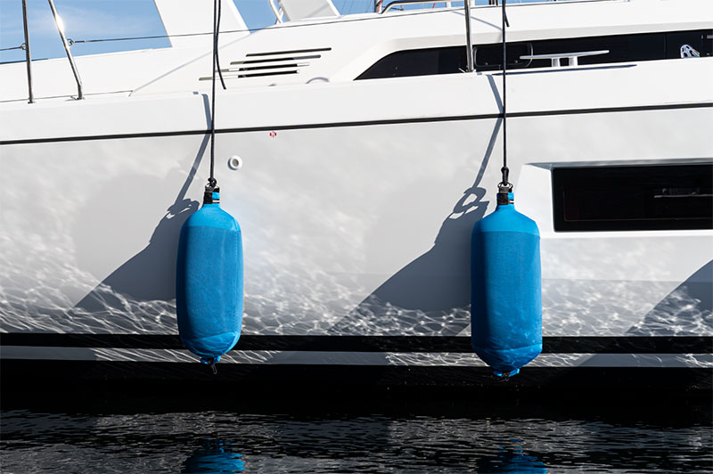 Royal Blue Fendertex Fenders on a Beneteau sailboat