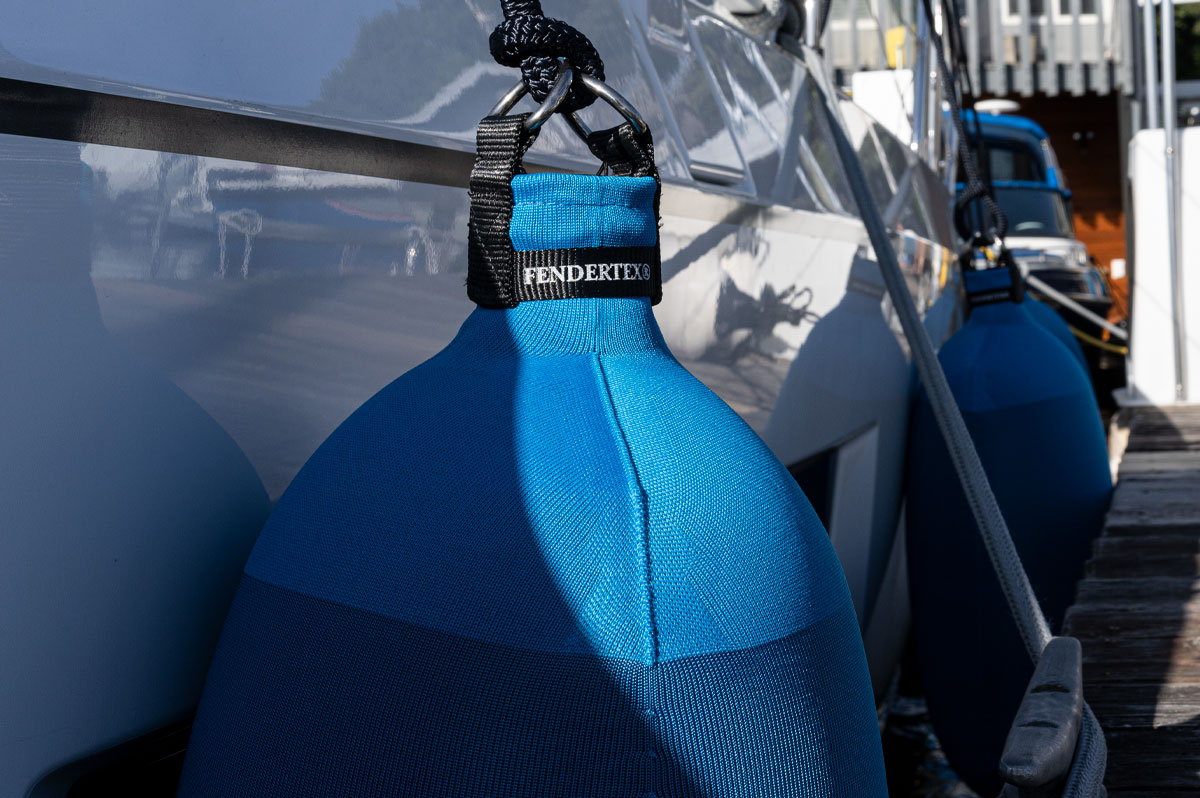 Royal Blue Fendertex Fenders on a Beneteau sailboat